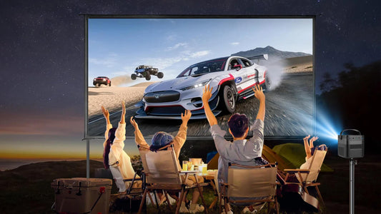 Family enjoying outdoor movie night with BBQ and Vision Beam projector